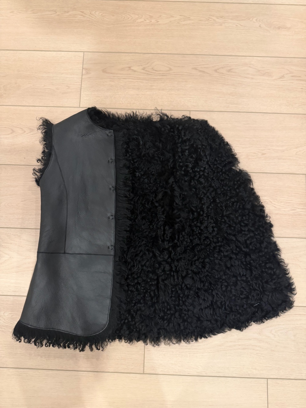 Reversible black leather shearling vest by luxury designer Joseph